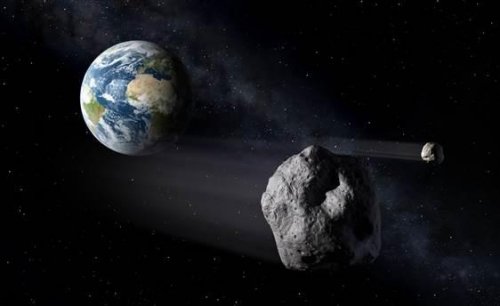 模拟图:小行星经过地球时的画面 模拟图:小行星经过地球时的画面